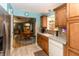 Charming kitchen with wood cabinets, tile backsplash, and stainless steel appliances at 3754 Smallwood W Ln, Indianapolis, IN 46214