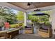 Back patio with fire pit, outdoor furniture, and lush greenery at 3904 Haverhill Dr, Indianapolis, IN 46240