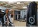 Basement home gym with modern exercise equipment and open layout at 3904 Haverhill Dr, Indianapolis, IN 46240