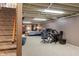 Finished basement with carpet, stairs, and flexible living space with multiple usages at 3904 Haverhill Dr, Indianapolis, IN 46240