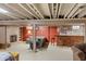 Finished basement featuring a brick fireplace, bar area, and comfortable seating at 3904 Haverhill Dr, Indianapolis, IN 46240
