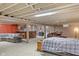 Finished basement offering a lounge area, bar, and a comfortable bed for guests at 3904 Haverhill Dr, Indianapolis, IN 46240