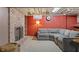 Finished basement with brick fireplace, comfortable seating, and recessed lighting at 3904 Haverhill Dr, Indianapolis, IN 46240