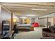 Spacious finished basement with sleeping and study areas and comfortable lounge seating at 3904 Haverhill Dr, Indianapolis, IN 46240