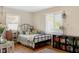 Comfortable bedroom with hardwood floors, natural light, and plenty of storage at 3904 Haverhill Dr, Indianapolis, IN 46240