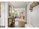 Inviting entryway with slate floors and decor, offering a view into the living room at 3904 Haverhill Dr, Indianapolis, IN 46240
