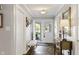 Entryway with slate floors, a bench, and view of the front door at 3904 Haverhill Dr, Indianapolis, IN 46240