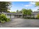Ranch style home with beautiful landscaping and attached three car garage at 3904 Haverhill Dr, Indianapolis, IN 46240