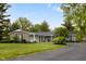 Charming home with manicured lawn, beautiful landscaping, and a welcoming facade at 3904 Haverhill Dr, Indianapolis, IN 46240