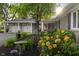 Charming home featuring a well-manicured front yard with colorful flowers and plants at 3904 Haverhill Dr, Indianapolis, IN 46240