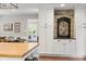 Kitchen with white cabinets, stone details, and black countertops at 3904 Haverhill Dr, Indianapolis, IN 46240