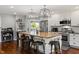 Kitchen with stainless steel appliances, a long island, and hardwood floors at 3904 Haverhill Dr, Indianapolis, IN 46240