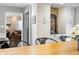 A kitchen with white cabinets and stainless steel appliances, viewed from the dining room at 3904 Haverhill Dr, Indianapolis, IN 46240