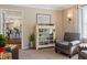 Comfortable sitting area with an display cabinet and view into the kitchen at 3904 Haverhill Dr, Indianapolis, IN 46240