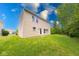 Spacious backyard with lush lawn and mature trees, perfect for outdoor activities at 4055 Steelewater Way, Indianapolis, IN 46235