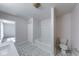 Bathroom featuring hexagon tile floor and bathtub with tiled surround at 4055 Steelewater Way, Indianapolis, IN 46235