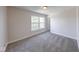 Bedroom with gray carpet and natural light from the windows at 4055 Steelewater Way, Indianapolis, IN 46235