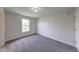 Bedroom featuring neutral walls, plush carpet, and natural light from a window at 4055 Steelewater Way, Indianapolis, IN 46235