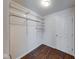 Walk-in closet with hardwood floors and wire shelving providing ample storage space at 4055 Steelewater Way, Indianapolis, IN 46235