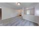 Bright hallway with neutral walls and plush gray carpeting throughout the home at 4055 Steelewater Way, Indianapolis, IN 46235