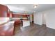 Well-equipped kitchen boasts an island, stainless appliances, and rich wood cabinetry at 4055 Steelewater Way, Indianapolis, IN 46235