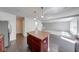 Well-equipped kitchen boasts an island, stainless appliances, and rich wood cabinetry at 4055 Steelewater Way, Indianapolis, IN 46235