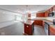 Well-equipped kitchen boasts an island, stainless appliances, and rich wood cabinetry at 4055 Steelewater Way, Indianapolis, IN 46235