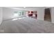 Spacious living room features plush carpeting, ample natural light and an open floorplan at 4055 Steelewater Way, Indianapolis, IN 46235