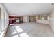 Spacious living room features plush carpeting, ample natural light and an open floorplan at 4055 Steelewater Way, Indianapolis, IN 46235