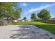 Spacious backyard with a gravel area and additional storage shed at 410 W Douglas St, Martinsville, IN 46151