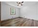 Bedroom featuring wood-look flooring and a modern ceiling fan at 410 W Douglas St, Martinsville, IN 46151