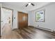 Bedroom featuring wood-look floors, double closets, and a ceiling fan at 410 W Douglas St, Martinsville, IN 46151