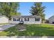 Charming single-story home with a well-manicured lawn at 410 W Douglas St, Martinsville, IN 46151