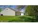 Spacious backyard with green lawn and white fence at 413 Woodberry Dr, Danville, IN 46122