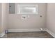 Unfinished basement space with window, utility connections, and vinyl flooring at 429 Colescott St, Shelbyville, IN 46176