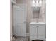 Bathroom featuring a vanity with a sink, white cabinet and a mirrored medicine cabinet at 429 Colescott St, Shelbyville, IN 46176