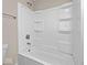 Clean bathroom featuring a bathtub and shower combination with built-in shelves at 429 Colescott St, Shelbyville, IN 46176