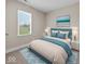 Comfortable bedroom with a window offering backyard views and a stylish blue rug at 429 Colescott St, Shelbyville, IN 46176
