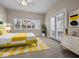 Bright bedroom with large windows and a stylish yellow and white rug at 429 Colescott St, Shelbyville, IN 46176