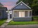 Charming home with a cozy screened-in front porch and well-maintained lawn at 429 Colescott St, Shelbyville, IN 46176