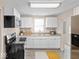 Modern kitchen with white cabinets, stainless steel appliances, and granite countertops at 429 Colescott St, Shelbyville, IN 46176
