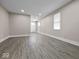 Open-concept living area with lots of natural light and hardwood flooring at 429 Colescott St, Shelbyville, IN 46176