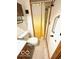 Cozy bathroom with safety grab bar in shower and country style curtain at 4419 Liberty Loop Rd, Martinsville, IN 46151