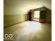 Large bedroom features carpet, built in shelves, and a window overlooking the side yard at 4419 Liberty Loop Rd, Martinsville, IN 46151
