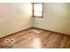 Cozy bedroom with wood floors and a window with blinds at 4419 Liberty Loop Rd, Martinsville, IN 46151