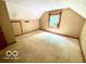 Bedroom features carpet and window looking out onto the side yard at 4419 Liberty Loop Rd, Martinsville, IN 46151