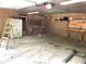 Interior view of garage with workbench and storage at 4419 Liberty Loop Rd, Martinsville, IN 46151
