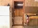 Interior view of garage with workbench, storage, and doorway to room at 4419 Liberty Loop Rd, Martinsville, IN 46151