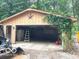 Exterior view of garage with open door and vine-covered support beam at 4419 Liberty Loop Rd, Martinsville, IN 46151