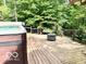Outdoor deck with a hot tub, swing and fire pit, perfect for entertaining and relaxation at 4419 Liberty Loop Rd, Martinsville, IN 46151
